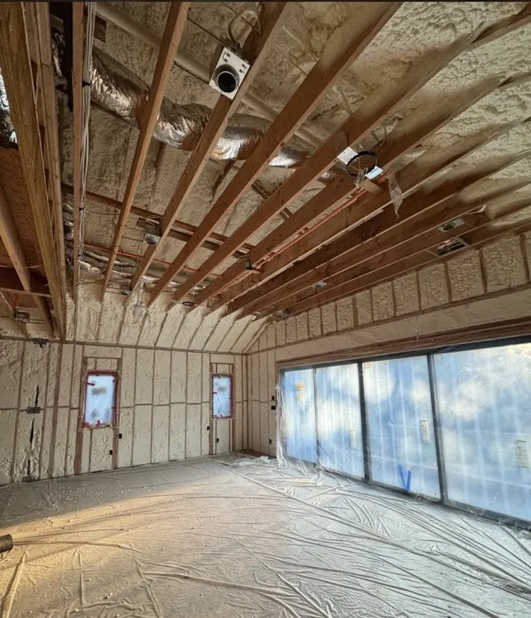 Interior walls and ceiling insulated with spray foam during new construction in Westmont